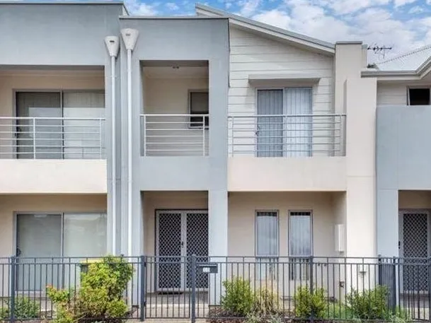Modern townhouse living with so many features, both inside & beyond!