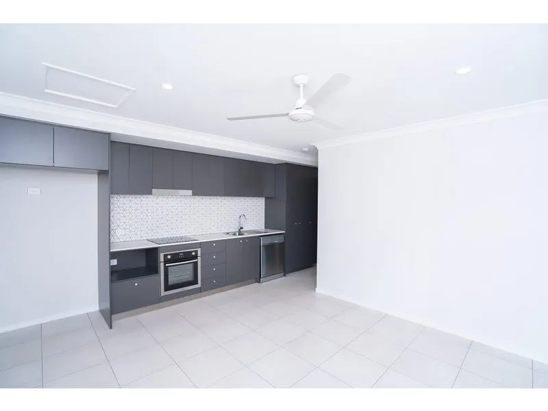 Modern 1 bedroom Unit, fully fenced, carport with remote lock up garage.  Use as a car park or as an outside entertaining area.