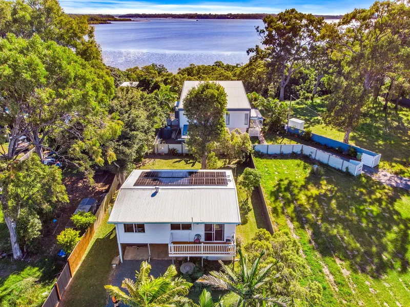 Highset Home with Water Views in a Prime Bay Island Location