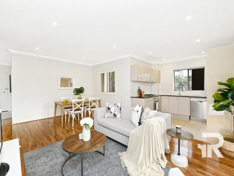 Light and bright apartment with free flowing floor plan, in super convenient locale