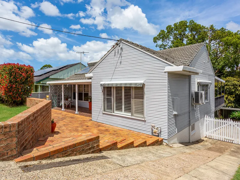 Year-round entertaining options in this lovely elevated 4-bedroom family home with views