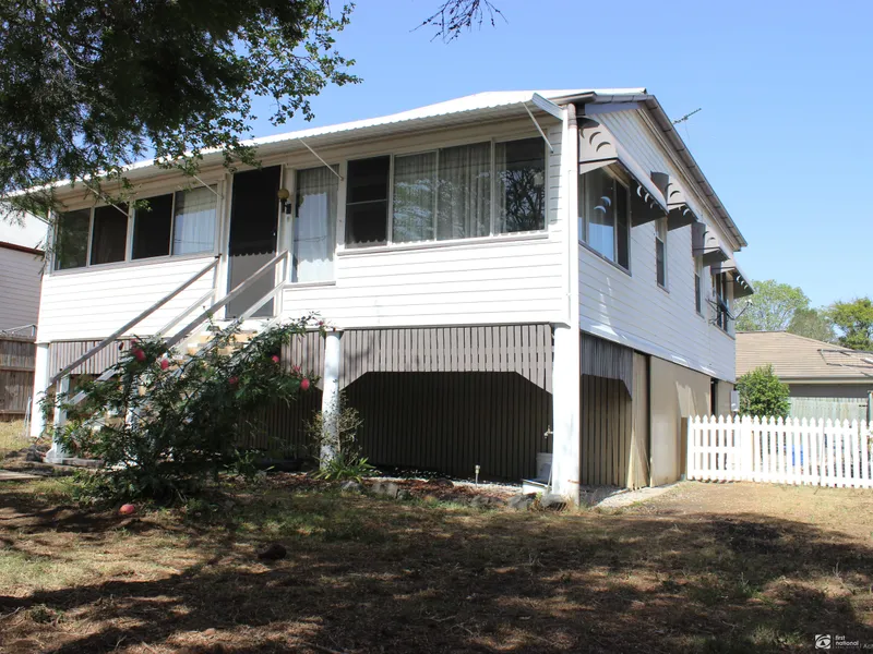 HIGH SET TIMBER QUEENSLANDER - 3 BEDROOMS PLUS A SLEEPOUT/STUDY-STORAGE UNDER HOUSE