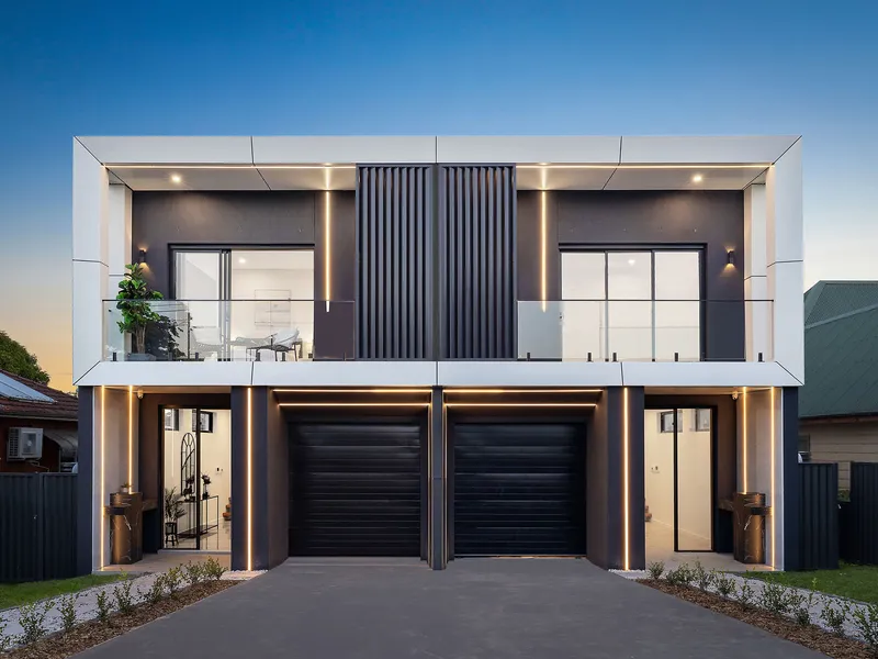 Brand New Full Brick and Concrete Slab Duplex With Distinctive Design