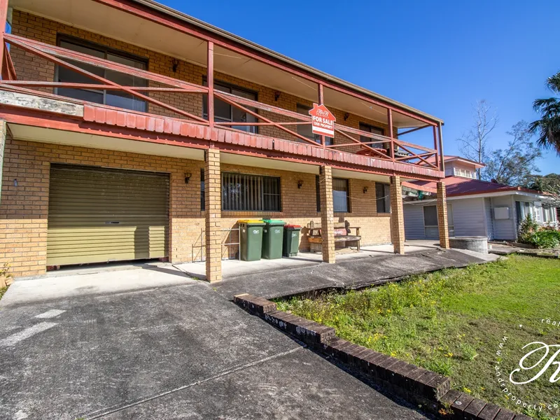 Renovators Delight, Filtered Lake Views, Prime Village Location