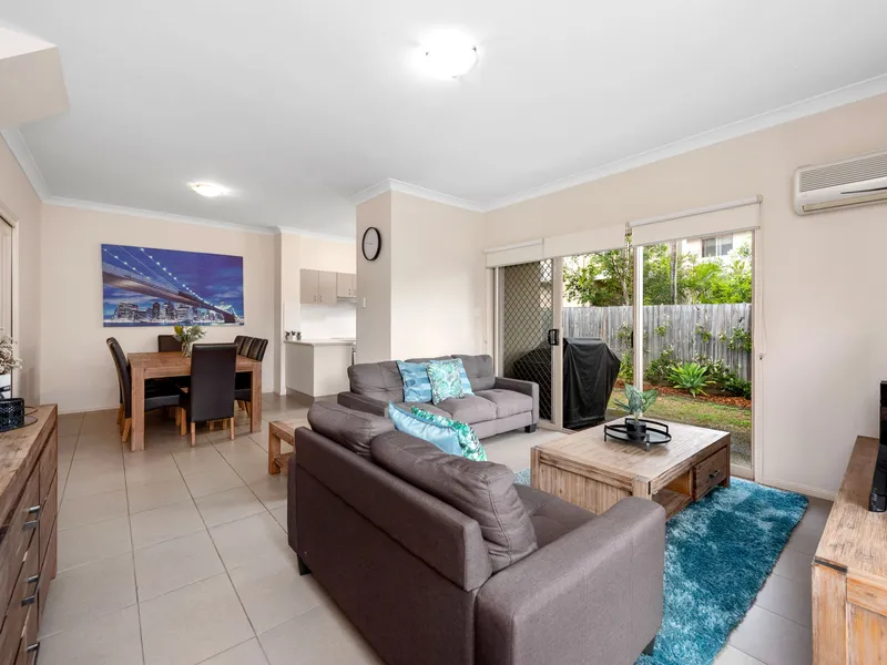 Affordable, corner-positioned townhome opposite lush greenspace!