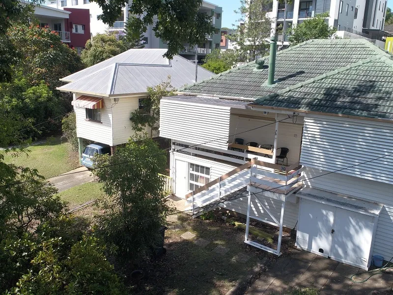 UNDER CONTRACT - A Solid Investment or Development - Quiet St - 4 Bedrooms and 620m2 - Zoned for Medium Residential. 