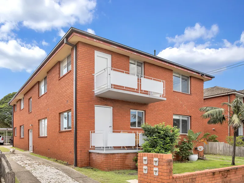 Top floor, bathed in sunshine is this fully renovated 2 bedroom apartment located in a small boutique block of 4.