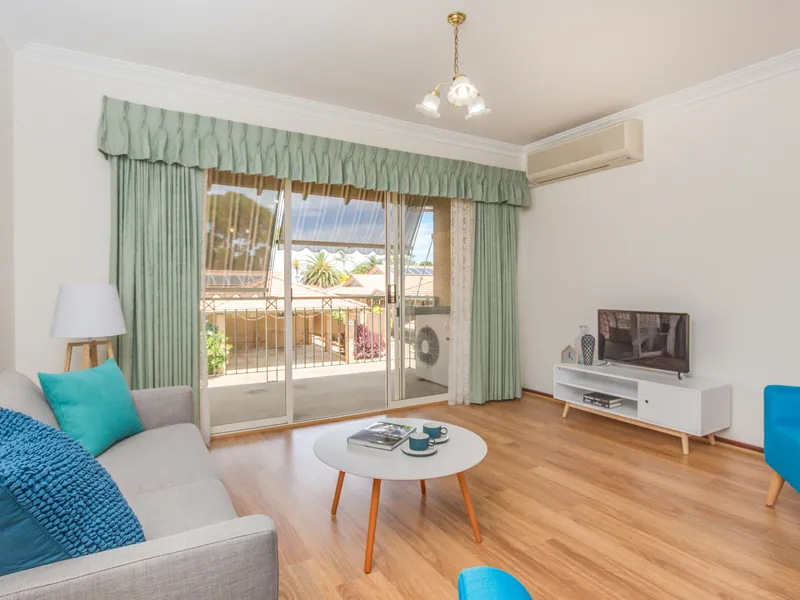 Relax and enjoy the large balcony and watch the world go by in this popular upper floor villa