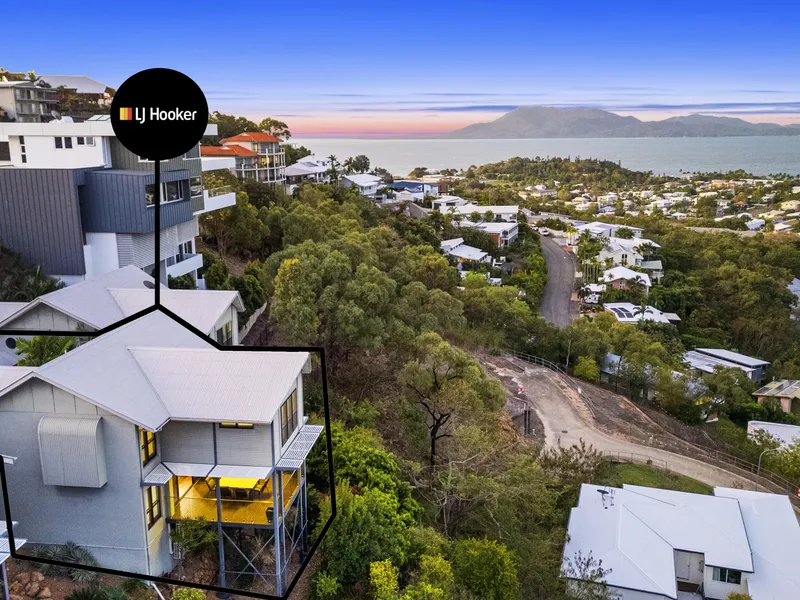 Nestled on the side of Castle Hill, this breathtaking 2-story hillside home offers an unparalleled living experience in Townsville.
