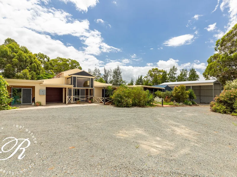 Private, tranquil resort-style living with income potential!