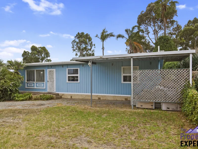This Little Blue House Needs A New Owner!!