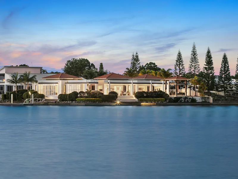 Palatial canal-front residence showcasing 59m water frontage, elegant bespoke design and 10m waterside pool