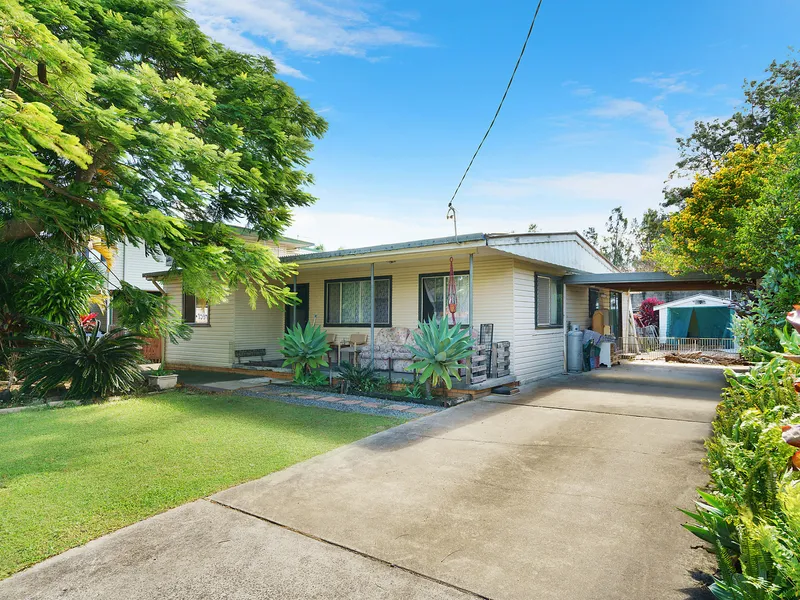 Family home with large shed at rear