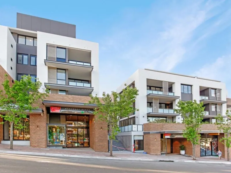 Large 1 bedroom apartment with study room and car space in a security building above the shopping centre