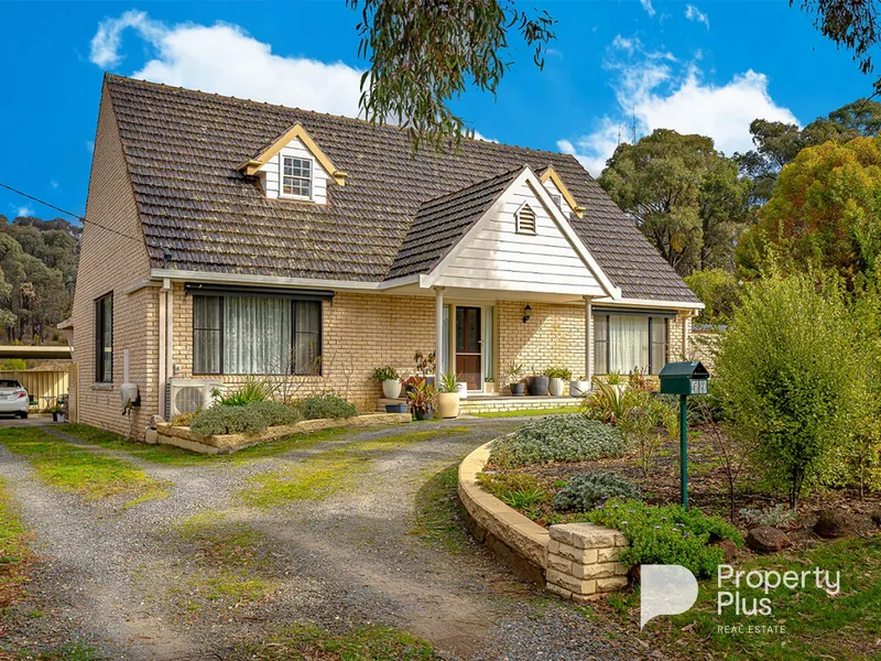 Charming 4-Bedroom Cape Cod Style Home in Serene Setting