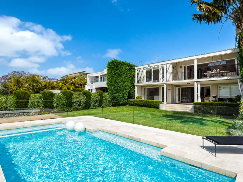A stunning family home with level lawns, pool and captivating views