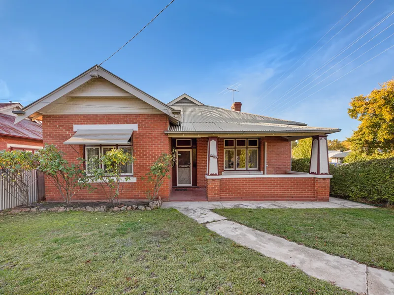 AS CENTRAL AS IT GETS - Beautiful Double Red Brick Home in Town!