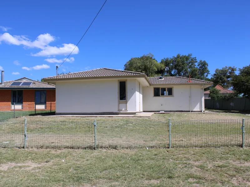 FRESHLY PAINTED AND CARPETED 3 BEDROOM HOME
