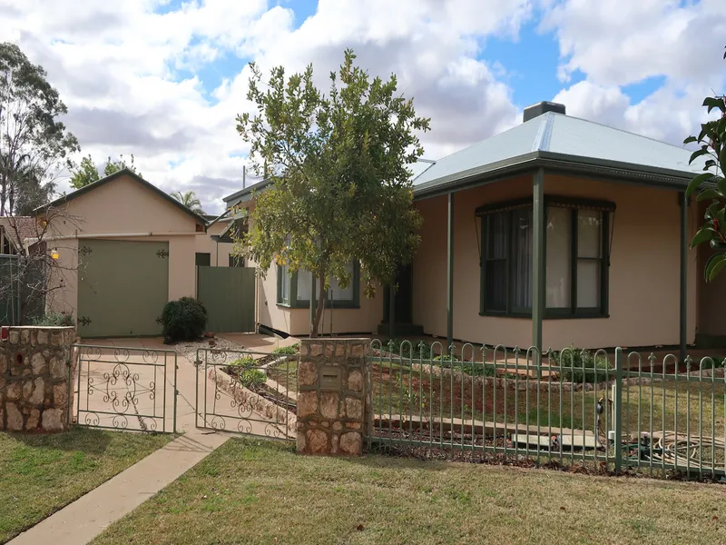 This ideally located three bedroom home features: