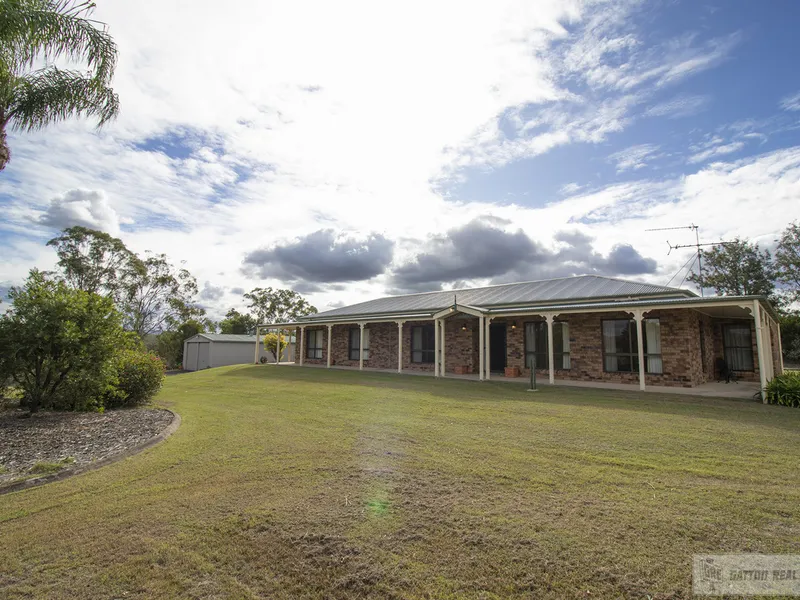 SPACIOUS AND STATELY RANCH STYLE HOME PERCHED ON A HILL