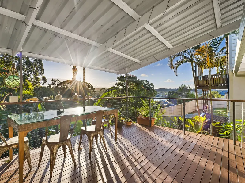 Gaze across the Tallebudgera creek from your own tropical oasis