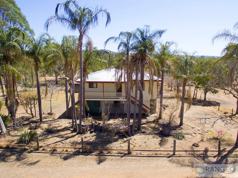 HIGH SET HOME WITH DUAL LIVING POSSIBILITIES