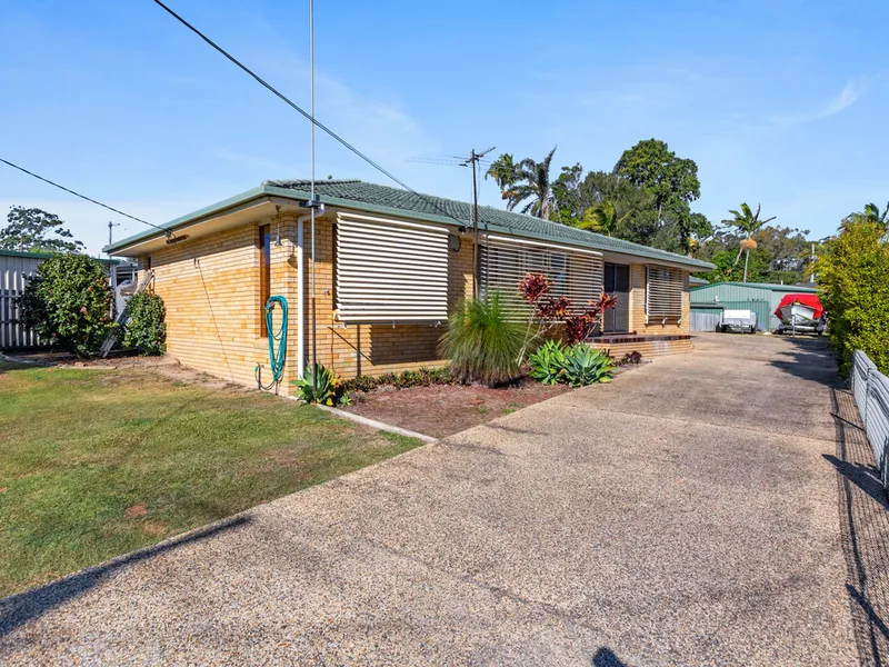 LOWSET BRICK HOME WITH WIDE SIDE ACCESS IN GREAT LOCATION