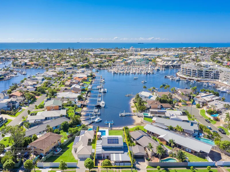 Prime Length of Canal Views with Distant Marina Setting the Perfect Backdrop 