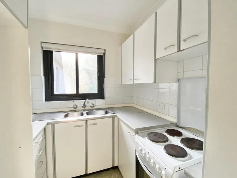 Top Floor Sun Filled Apartment with Parking