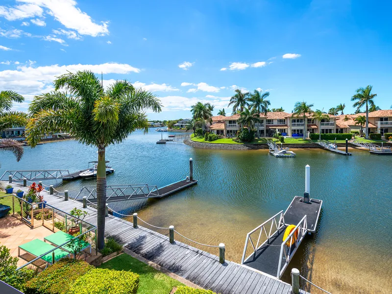 North Facing Waterfront Stunner with Long Canal Views + Pontoon!