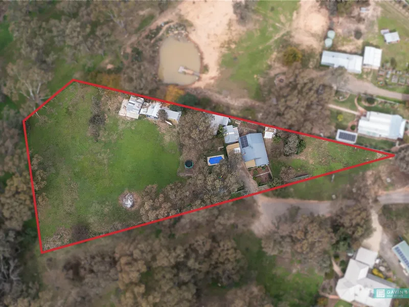 Family home with extensive shedding on 1.66 acres