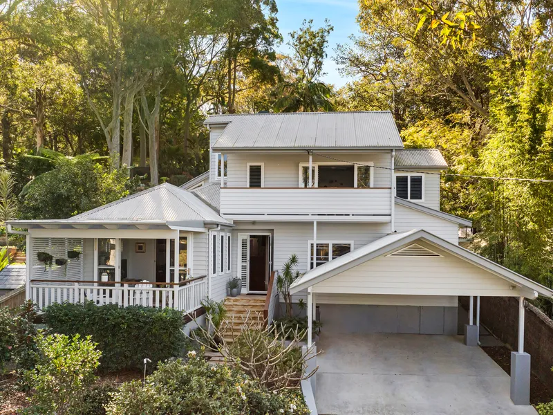 Light filled split level delight with expansive tiered north facing backyard