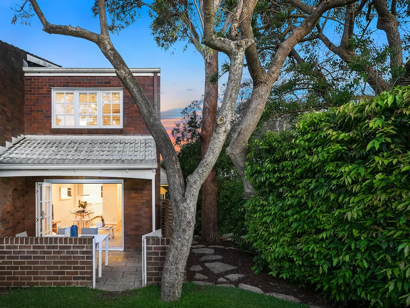 Impeccably renovated townhouse privately immersed in lush tranquil gardens