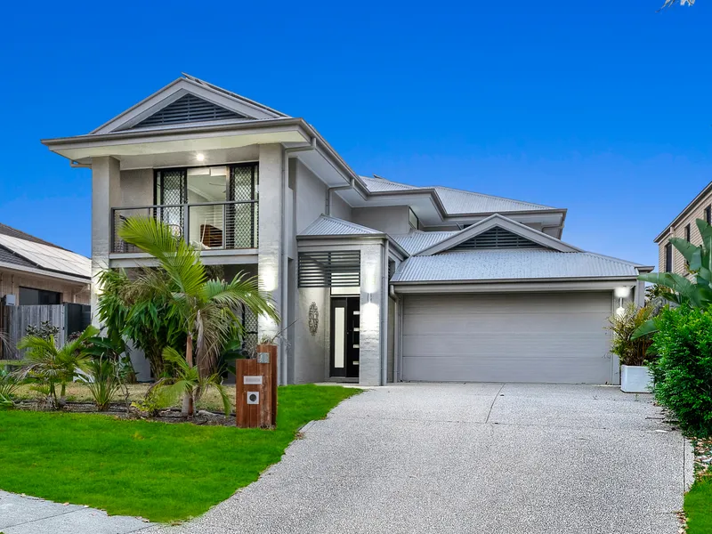 Opulent Family Retreat with Luxurious Master Suite and Resort-Like Backyard