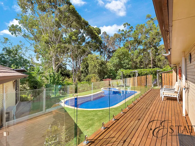 Beautiful home with Teenage/Parent Retreat, pool, and native creek setting opposite Gunda Reserve