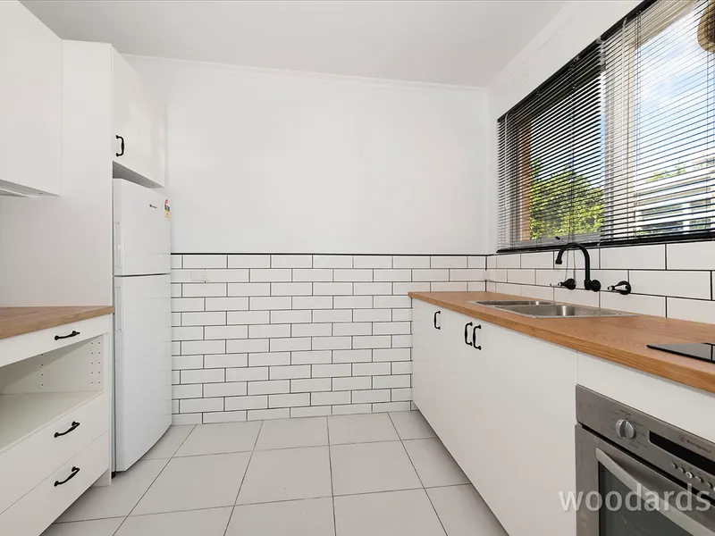 Stylish and Beautifully Renovated, Top Floor Residence in Boutique Development and Prized Locale