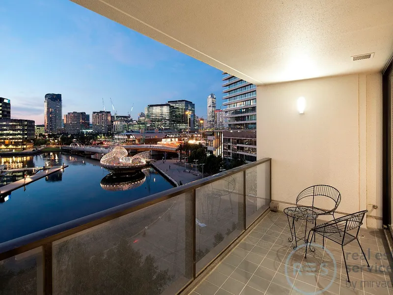 A luxury waterfront address boasting marina & city views