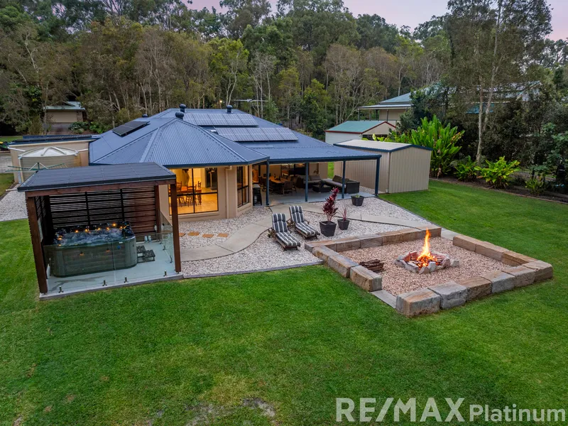 Superb family home oozing space & serenity with bushland views.