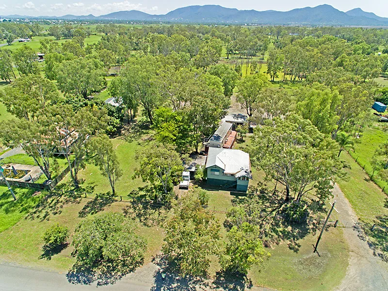 GABLE STYLE HOME ON ALMOST 2 ACRES OF FENCED LAND + 4 DONGA'S. SERVICING RAMP FOR LARGE MACHINERY. SHEDS. $299,000