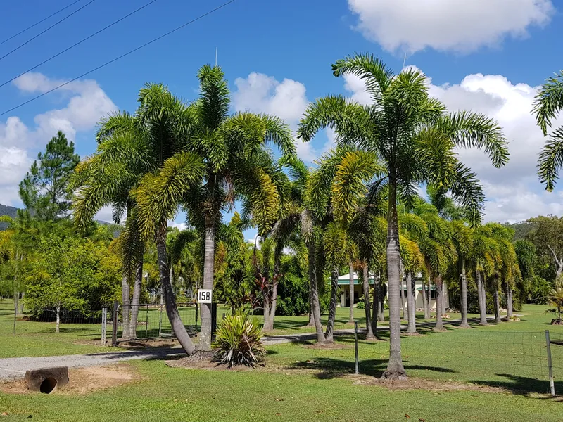 Rural retreat surrounded by lush tropical gardens  & lawns with magnificent mountain views