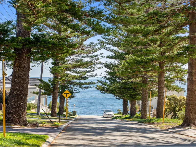 “Tree lined street and sandy feet”