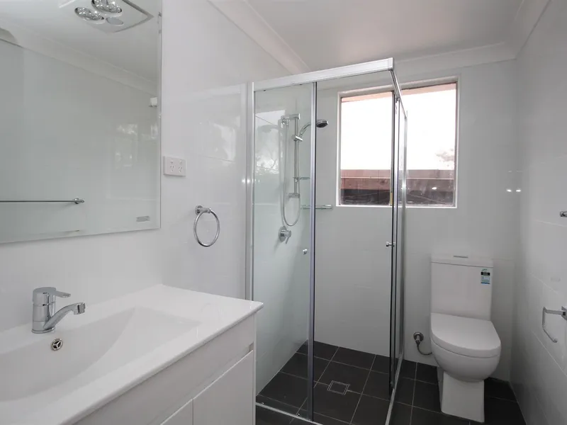 This stunning single level red brick home has everything you need!