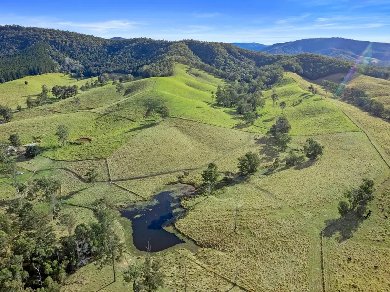 330 Acres on 2 Titles with Water!