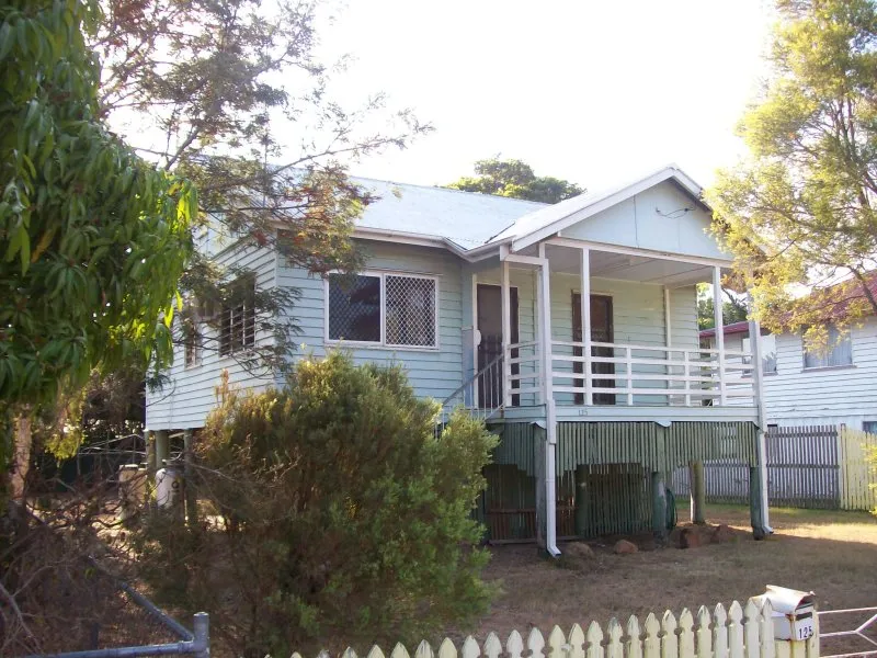 CLASSIC HIGHSET WEATHERBOARD GABLE HOME WITH PINE INTERIOR AND OPEN FRONT VERANDAH.