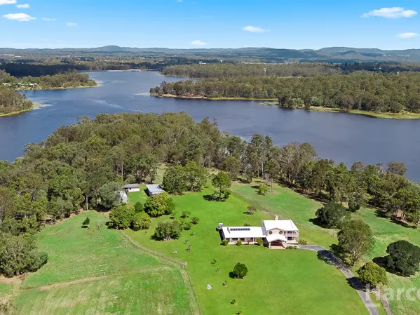 Beautiful Home On The Lake With Over 23 Acres Of Privacy!