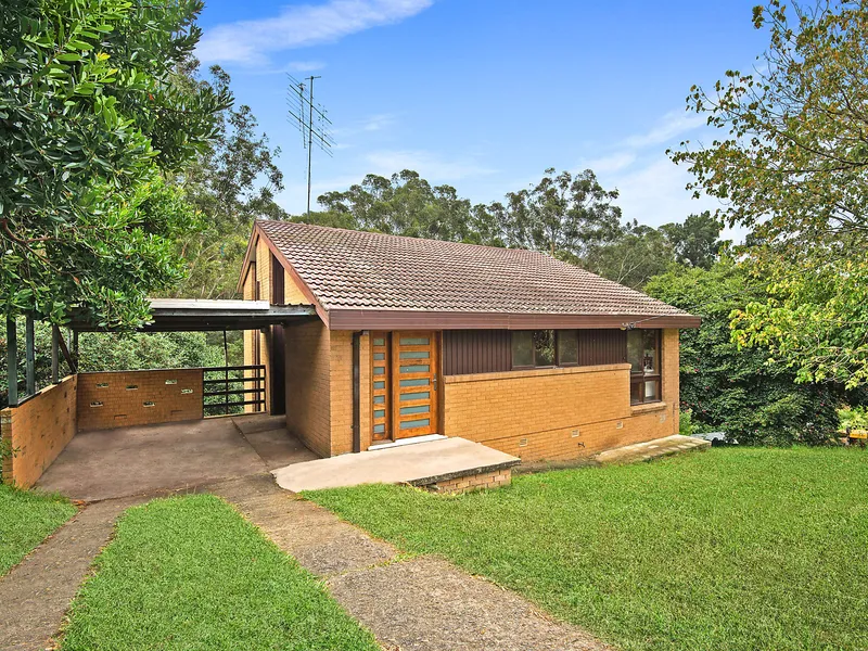 Privately set home basks in quiet bushland backdrop
