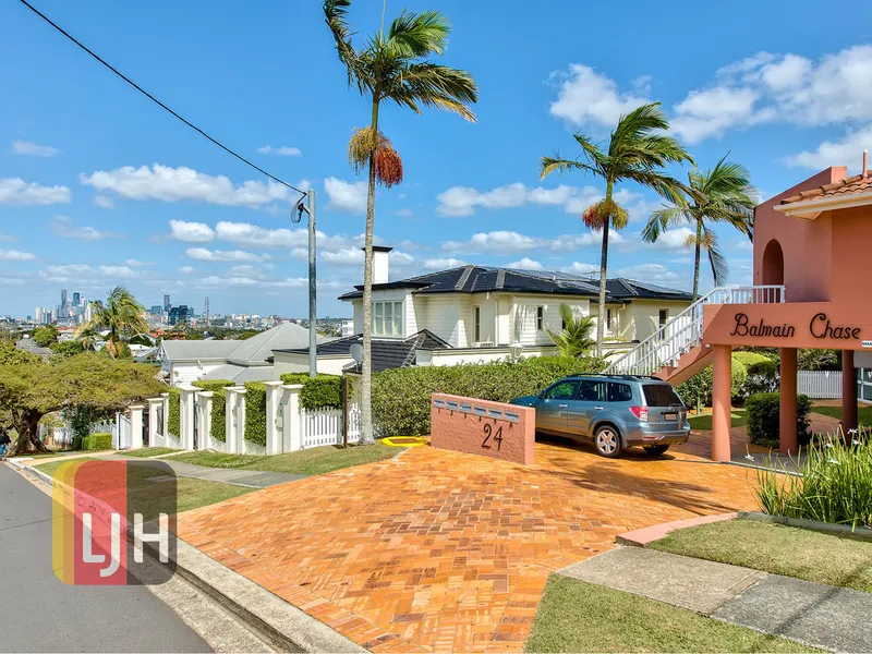 LIGHT & BRIGHT, ELEVATED TWO BEDROOM UNIT WITH VIEWS
