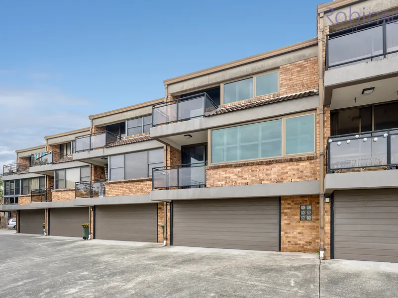 Larger than average, air-conditioned townhouse with district views and a double garage.