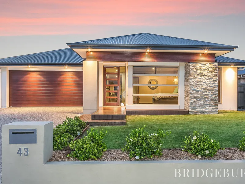 STANDOUT FAMILY HOME WITH THREE LIVING AREAS, SOLAR & A SWIMMING POOL