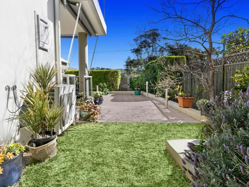 Designer Garden Apartment in Security Building